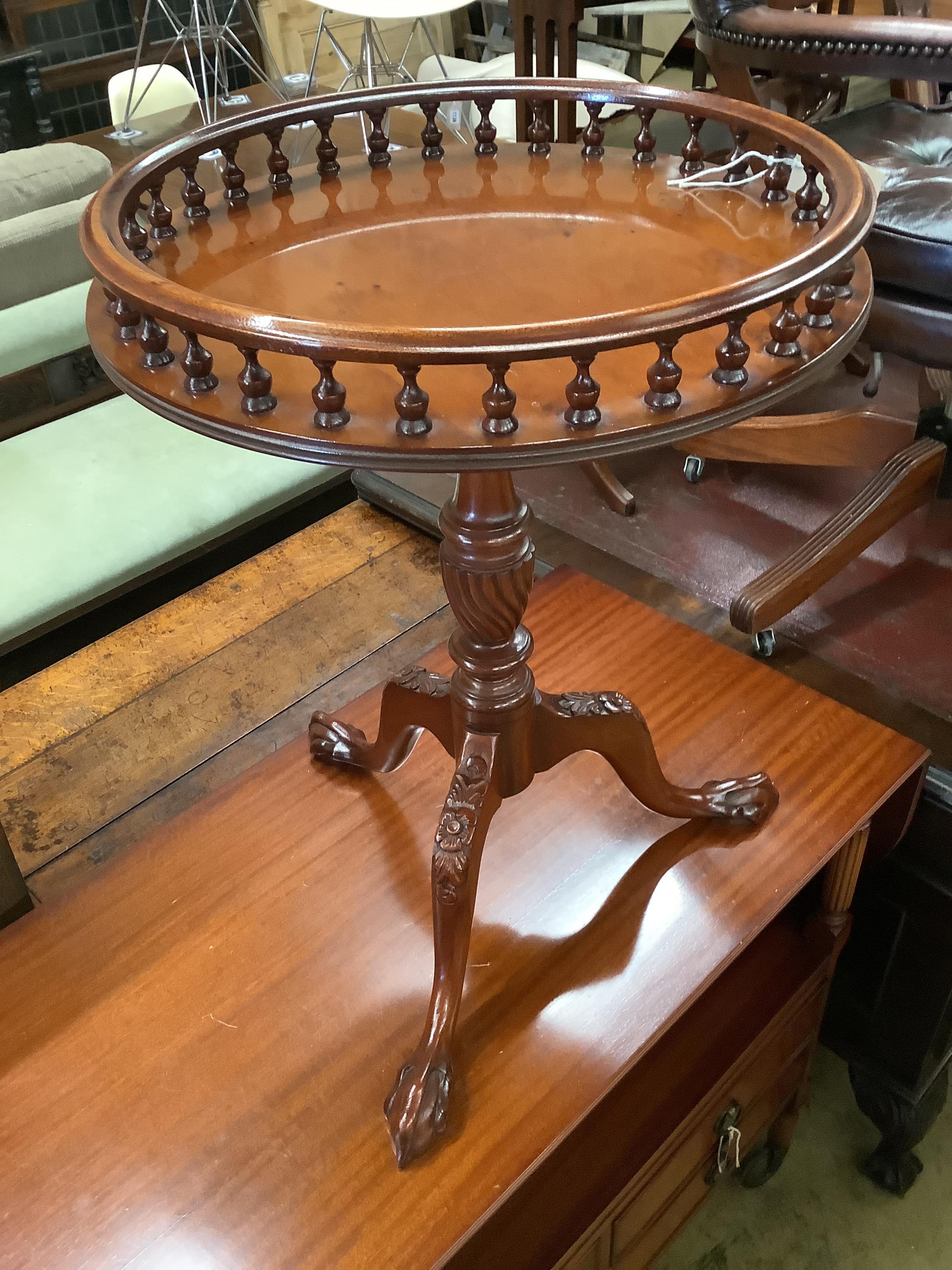 A circular occasional table with galleried top, diameter 48cm together with a drop-flap buffet table with raised top